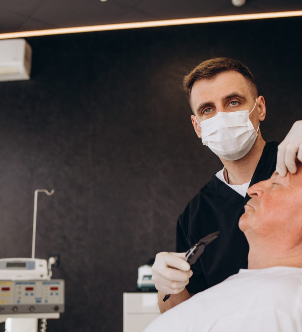 Old man visiting male doctor for plastic surgery Old man visiting male doctor for plastic surgery